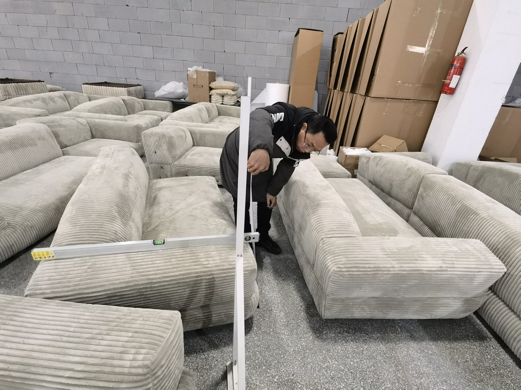 Multiple finished sofas checked together before packing