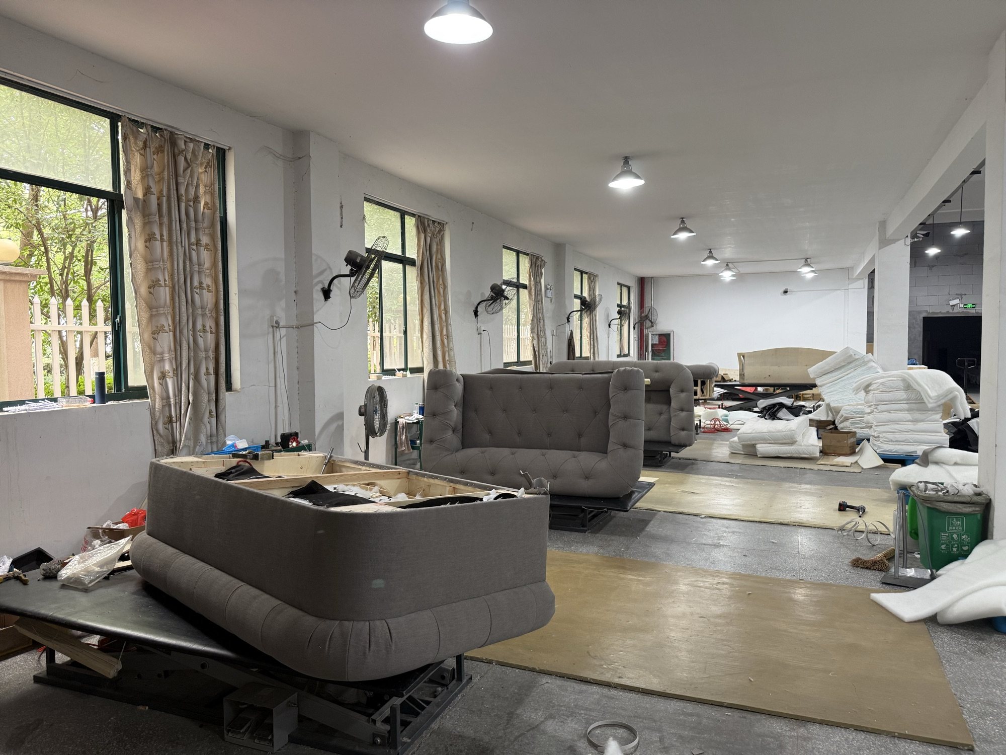 Upholstery assembly floor with sofas in progress
